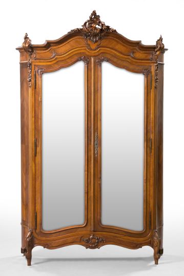 Appraisal: Louis XV-Style Mahogany Armoire the bonnet top centered by an