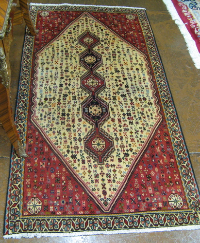 Appraisal: PERSIAN ARDEBIL AREA RUG having a diamond-shaped ivory field centering