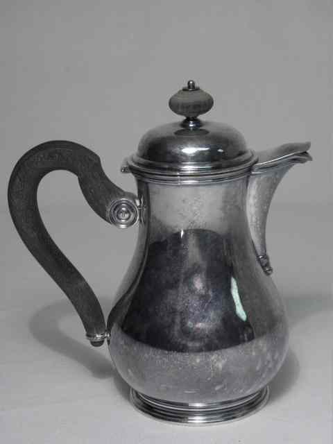 Appraisal: Tezler Swiss silver syrup jug with an ebonized wood loop