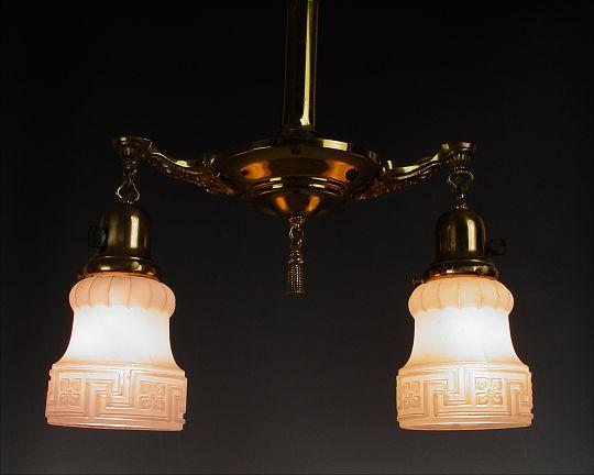 Appraisal: VICTORIAN TWO LIGHT CHANDELIER Brass tassel hangs between a pair