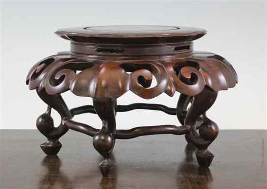 Appraisal: A Chinese rosewood stand the petal lobed top above a