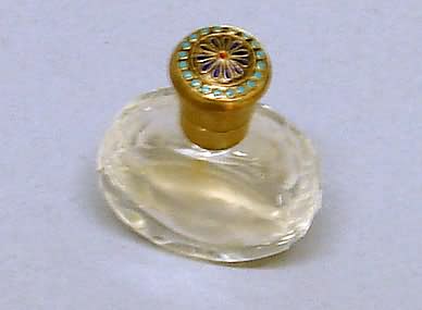 Appraisal: Clear glass bottle with enamel hinged lid top with internal