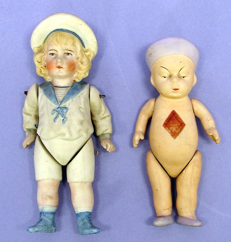 Appraisal: Wire strung male child Molded features and molded sailor suit