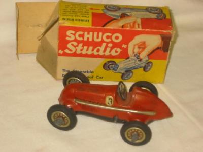 Appraisal: A Schuco Studio racing car tin plate clockwork action boxed