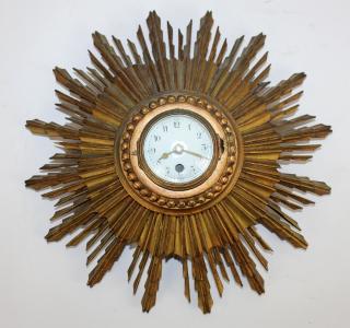 Appraisal: Vintage sunburst wall clock Vintage enamel face sunburst wall clock