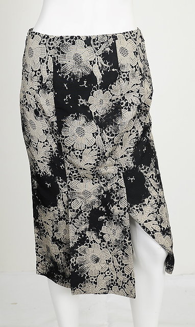 Appraisal: A black and cream floral printed Alexander McQueen skirt flap