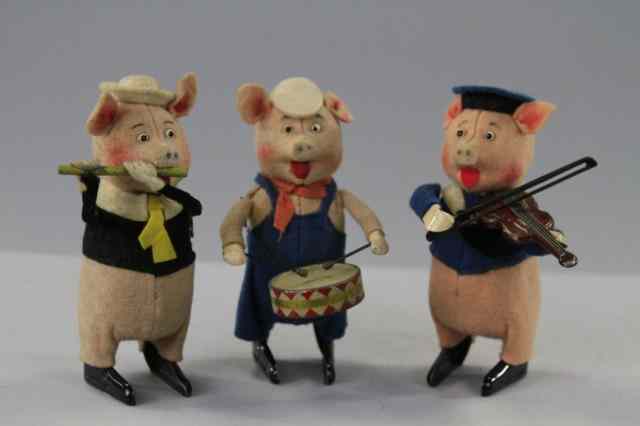 Appraisal: THREE LITTLE PIGS Schuco Germany clockwork operated each depicted with