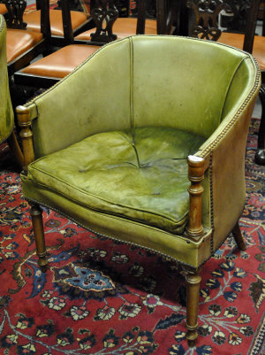 Appraisal: A pair of studded leather tub chairs on turned supports