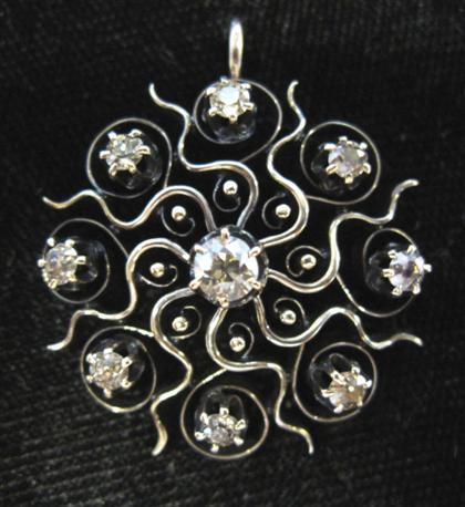 Appraisal: Silver and diamond starburst broochD in