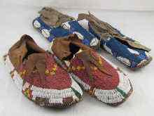 Appraisal: Two pairs of Canadian Indian moccasins completely covered with coloured