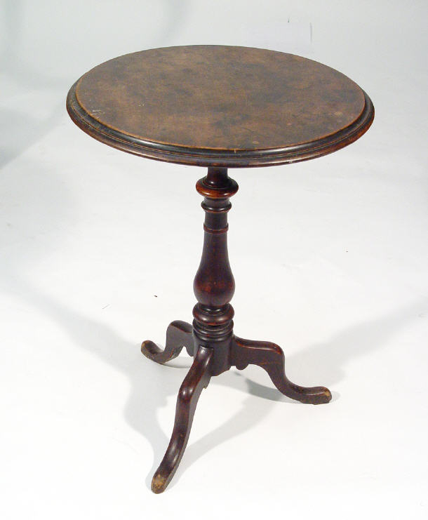 Appraisal: Circular snap top wine table on balustered turned column with