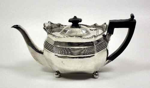 Appraisal: A George III silver teapot of octagonal panelled form the