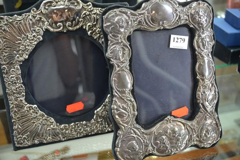 Appraisal: TWO STERLING SILVER EMBOSSED PHOTO FRAMES INCL ANGELS PATTERN