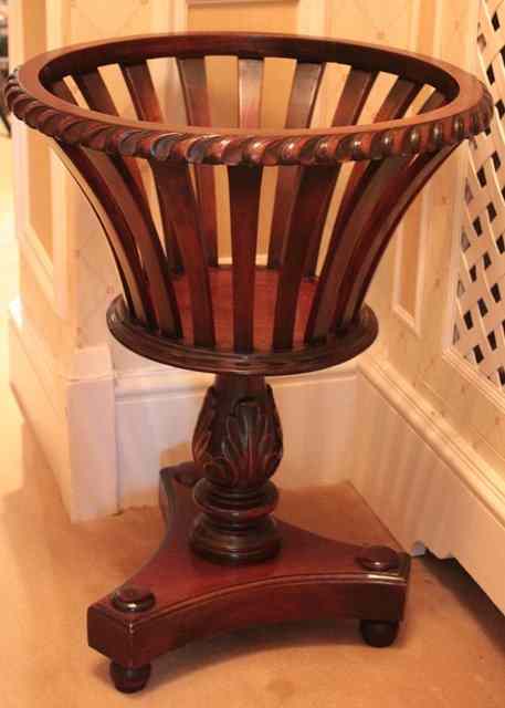 Appraisal: A VICTORIAN STYLE MAHOGANY JARDINIERE STAND the gadrooned rim on