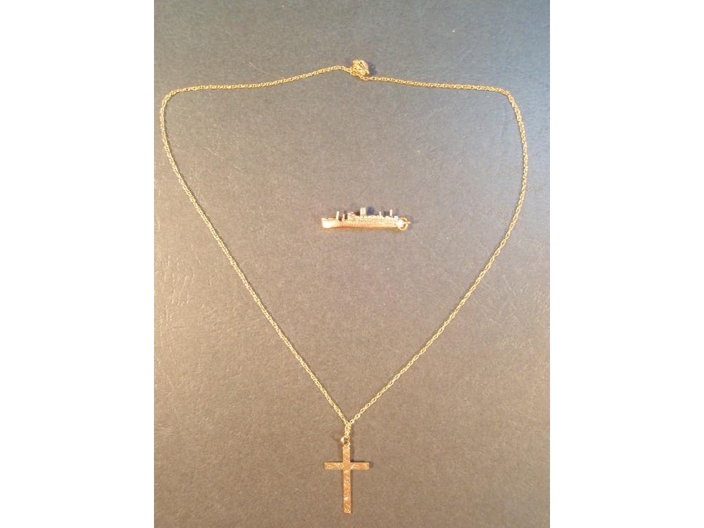 Appraisal: A ct gold crucifix and chain and a ct gold