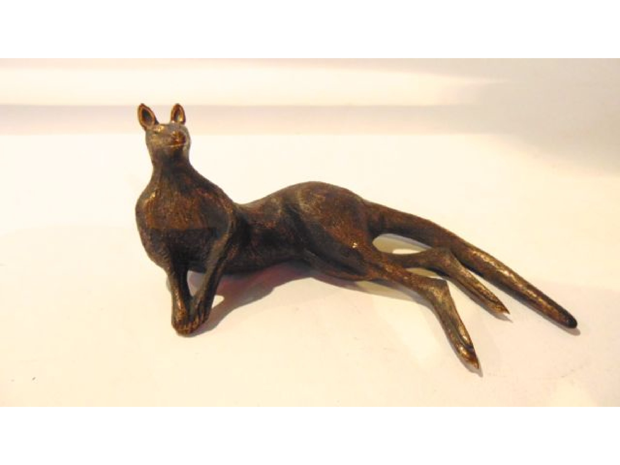 Appraisal: A bronze figure of a recumbent kangaroo signed Mary Mickelmore