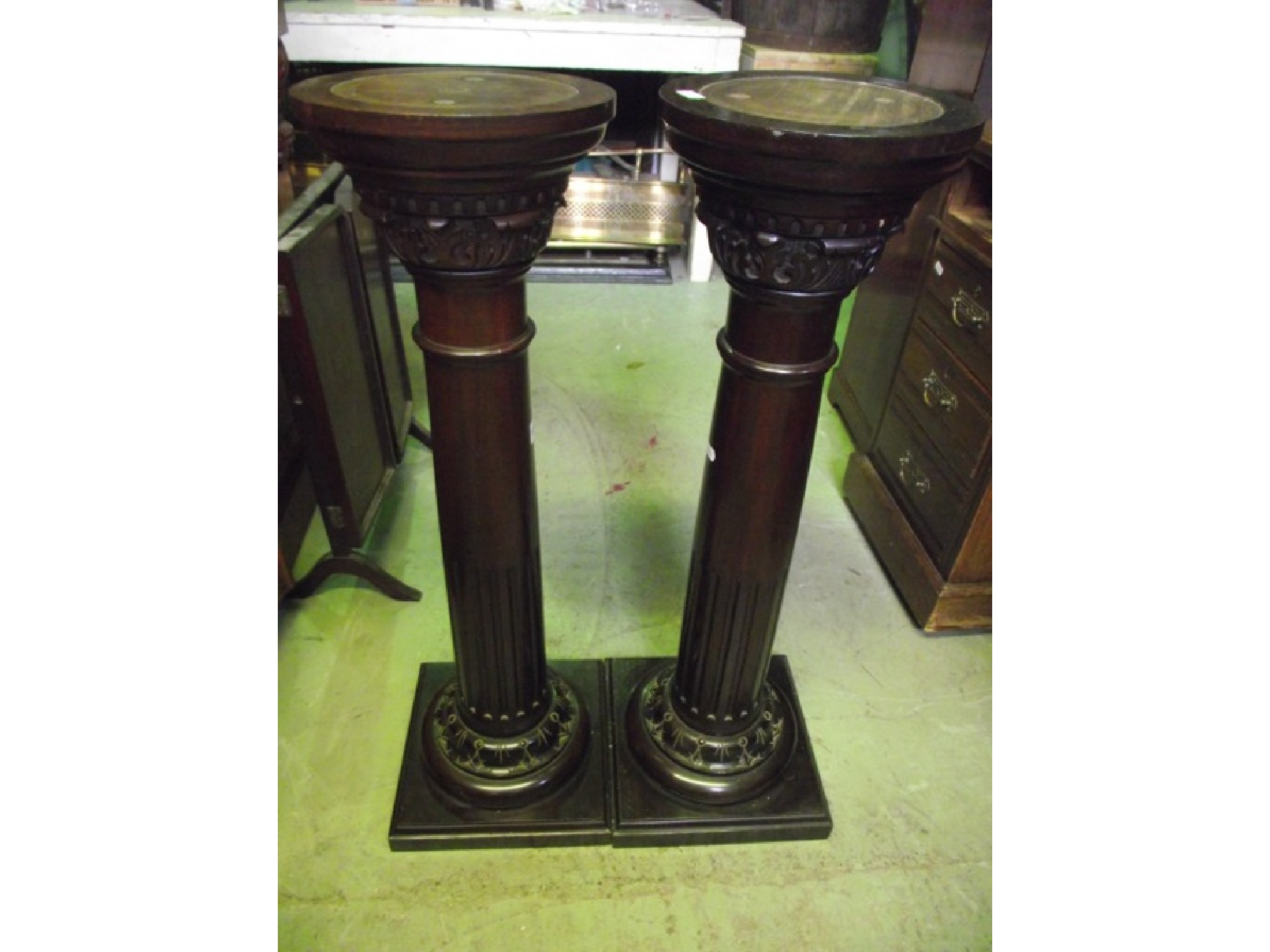 Appraisal: A pair of mahogany pedestals jardineres with turned columns with