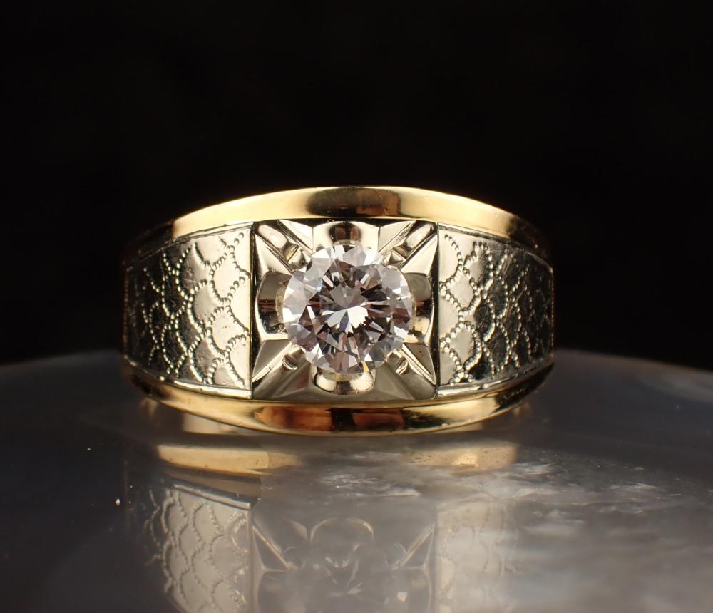 Appraisal: MAN'S DIAMOND AND FOURTEEN KARAT GOLD RING The yellow and