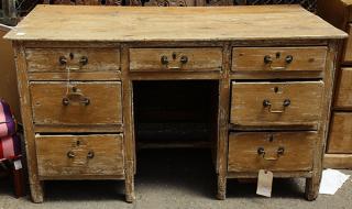 Appraisal: English style distressed double-pedestal desk mid th century having a