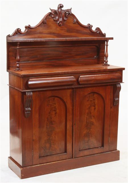 Appraisal: A Victorian mahogany chiffonier the arched foliate carved back gallery