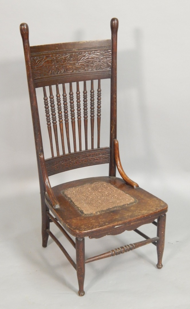 Appraisal: An American stained beech nursing chair with a carved back