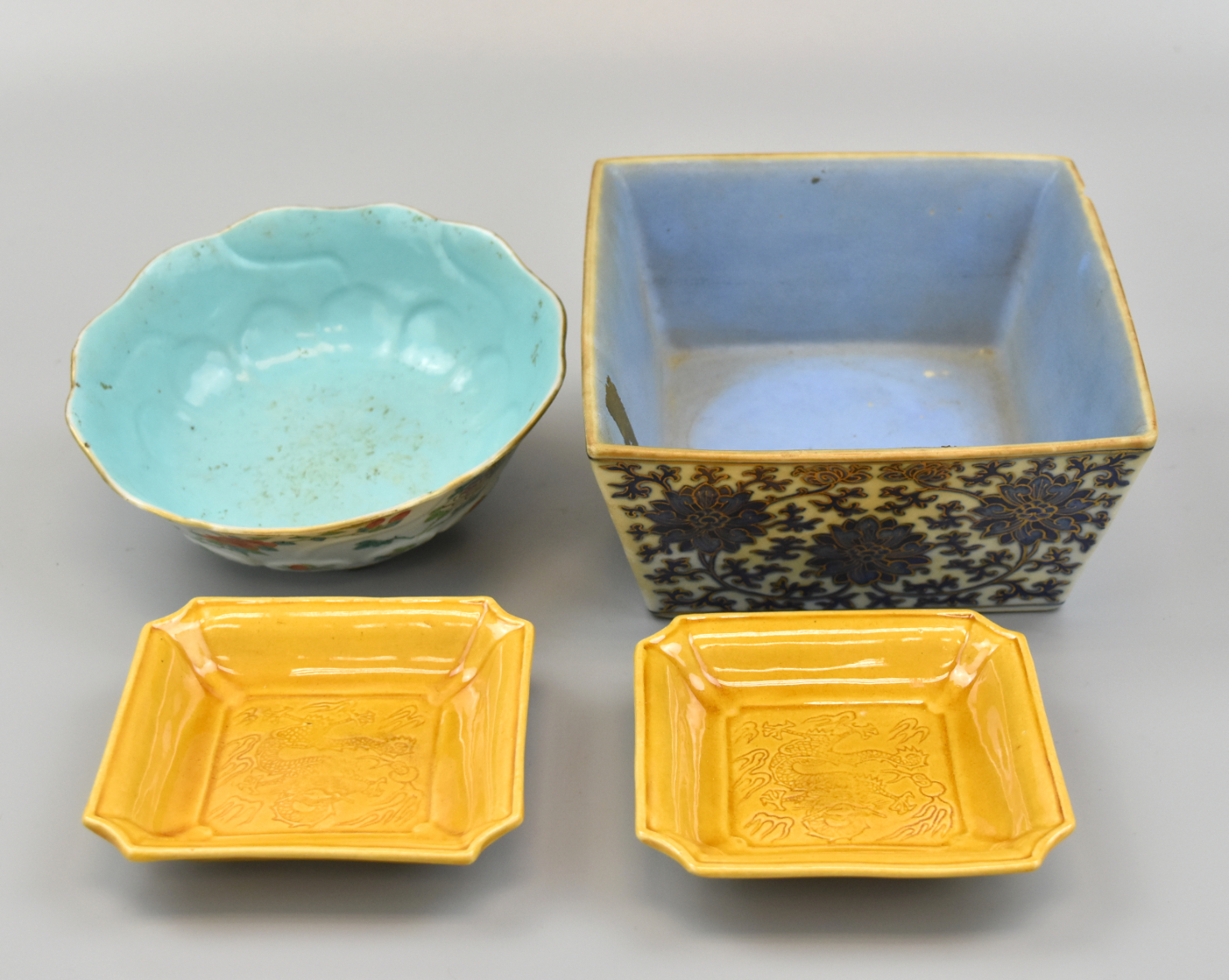 Appraisal: Chinese group of two square shaped yellow glaze dishes with