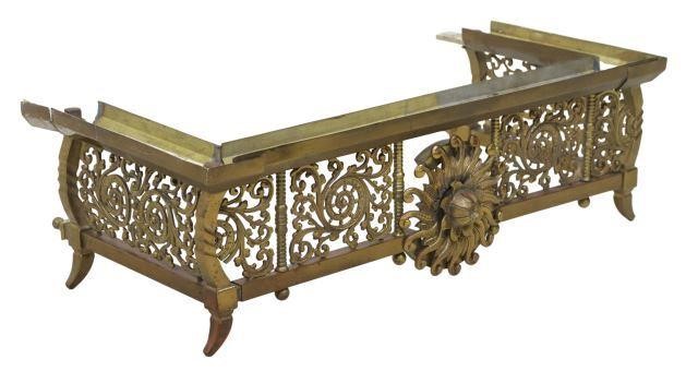 Appraisal: Fireplace fender having central floral medallion pierced foliate sides finials