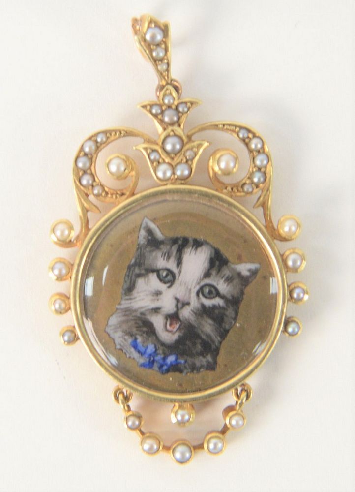 Appraisal: Karat Gold Medallion with enameled cat set with small pearls