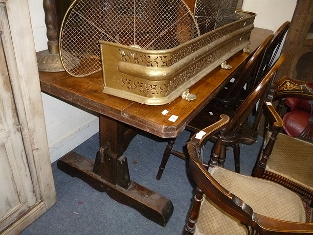 Appraisal: AN OAK REFECTORY TABLE with shaped ends united by pegged