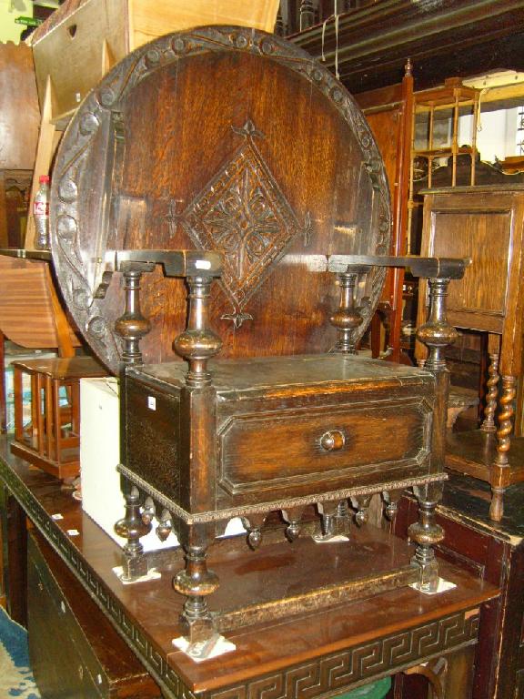 Appraisal: A late Victorian oak monks bench the circular top with