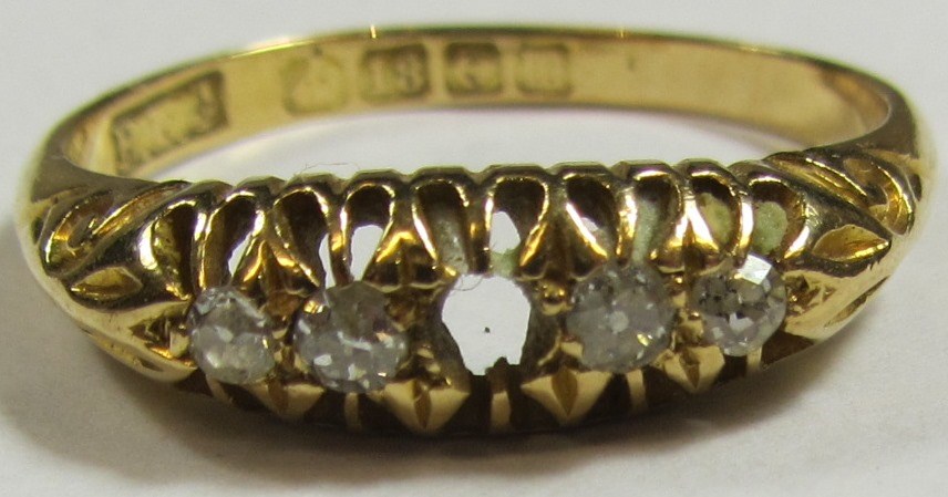 Appraisal: An ct gold ring mounted with a row of four