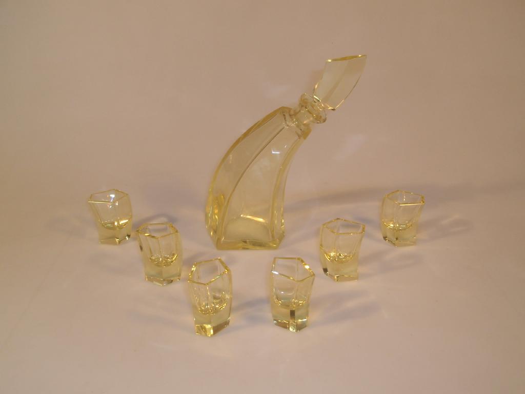 Appraisal: An Art Deco lemon glass liqueur set of semi-scalene pentagonal