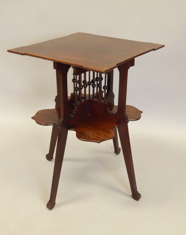 Appraisal: An unusual Edwardian mahogany book table the square top with