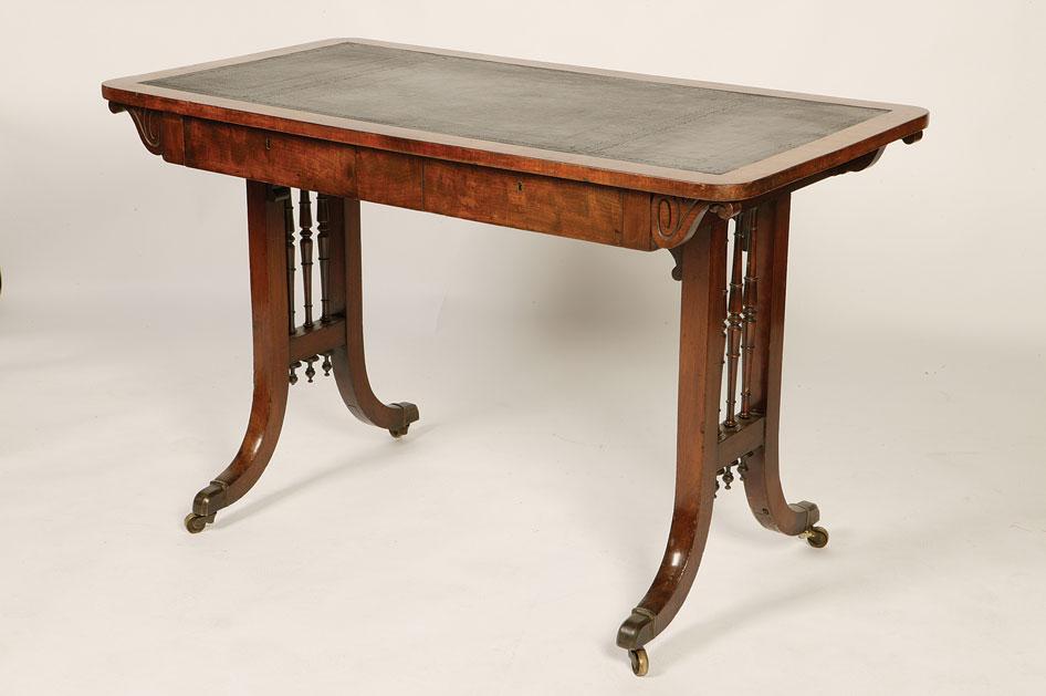 Appraisal: A REGENCY MAHOGANY LIBRARY TABLE the rectangular top with rounded