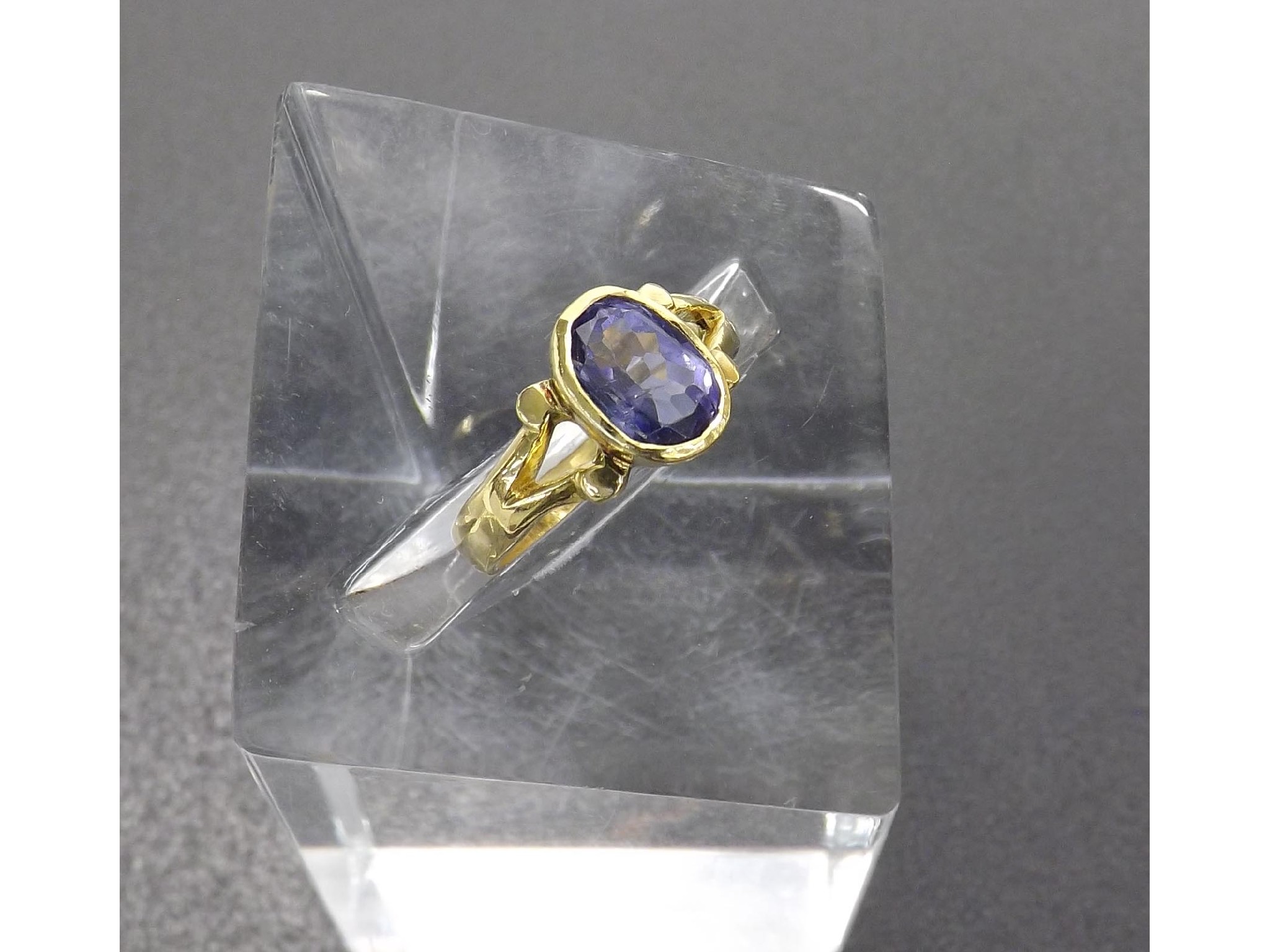 Appraisal: M RY ct oval tanzanite rub-over set single stone ring