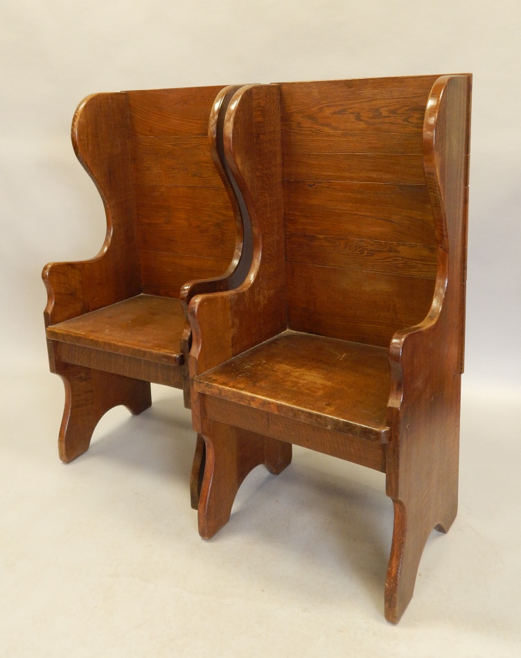 Appraisal: A pair of Arts Crafts style solid oak wingback type