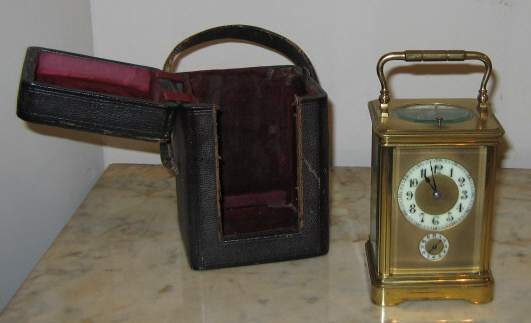 Appraisal: GROTTENDIECK BELGIAN CARRIAGE CLOCK Circular porcelain dial with gilt metal