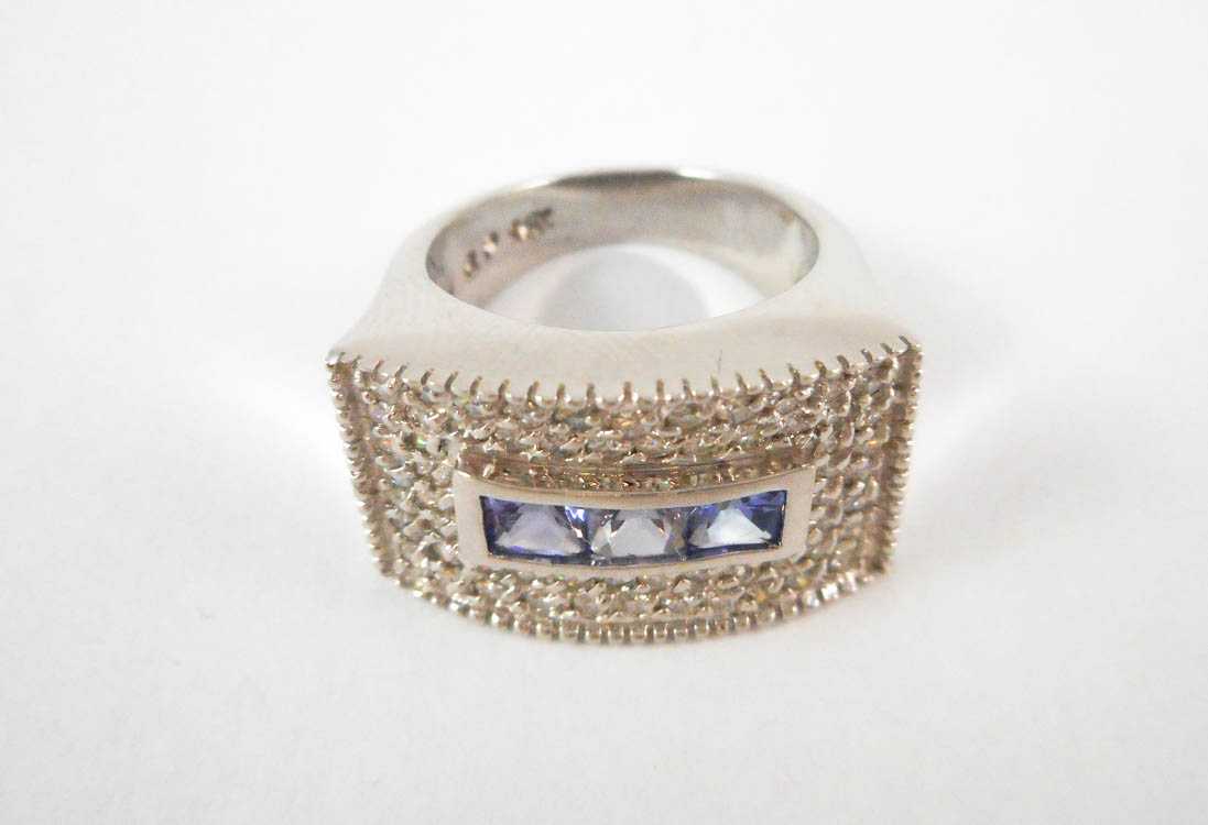 Appraisal: TANZANITE MOISSANITE AND FOURTEEN KARAT GOLD RING The white gold