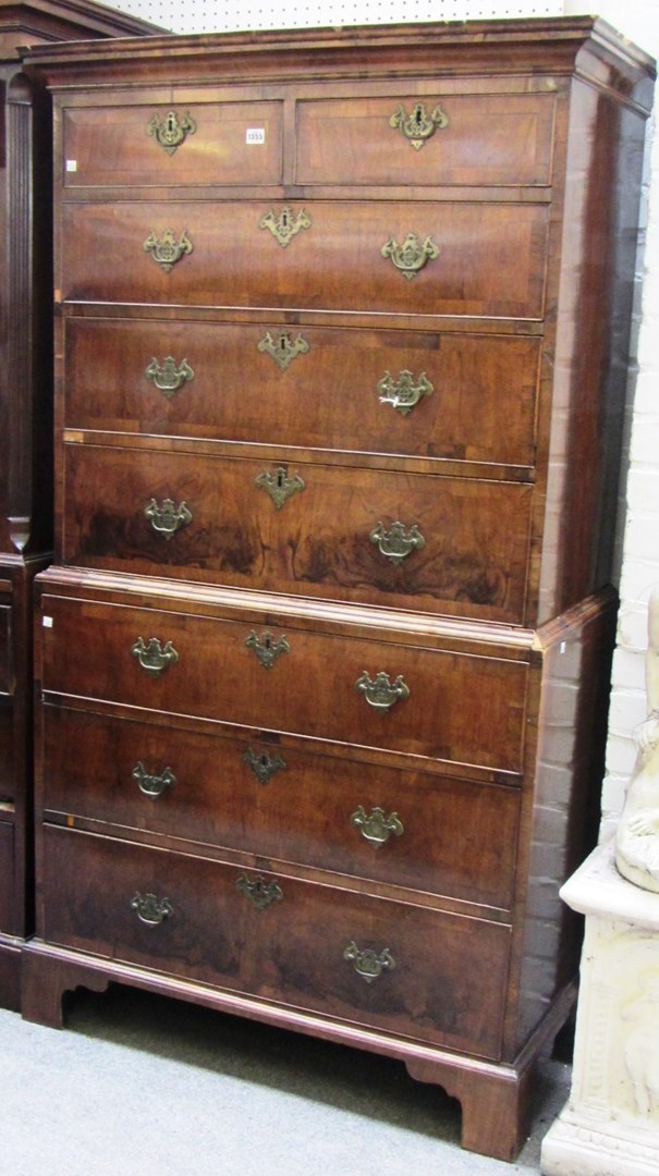 Appraisal: A mid th century figured walnut chest on chest of