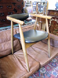 Appraisal: BLACK TEAK UPHOLSTERED ARM CHAIR