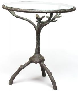 Appraisal: After Diego Giacometti The rounded glass top surmounting a bronze