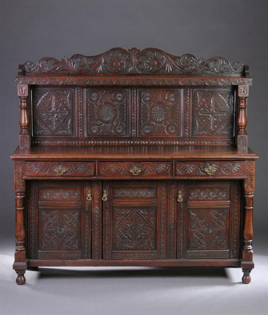 Appraisal: ENGLISH ARTS CRAFTS CARVED OAK BUFFET circa Stepped-back shelved superstructure