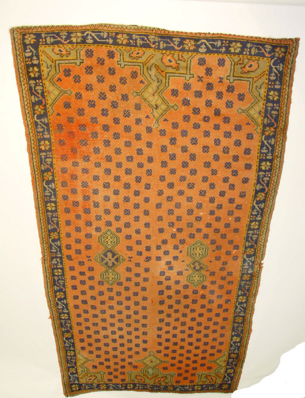 Appraisal: Rectangular rug decorated with blue flowers onto a predominantly red