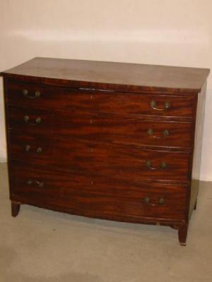 Appraisal: A MAHOGANY CHEST of bowed form and comprising four graduated