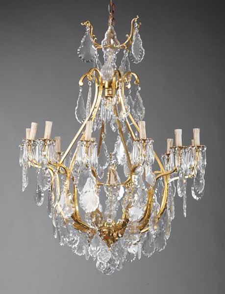 Appraisal: A Pair of Louis XV-Style Nineteen Light Chandeliers twelve scrolling