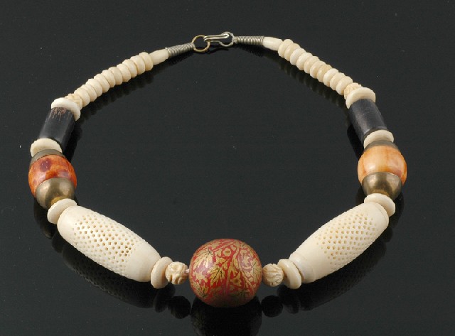 Appraisal: A tribal necklace Comprising carved and polished bone links together