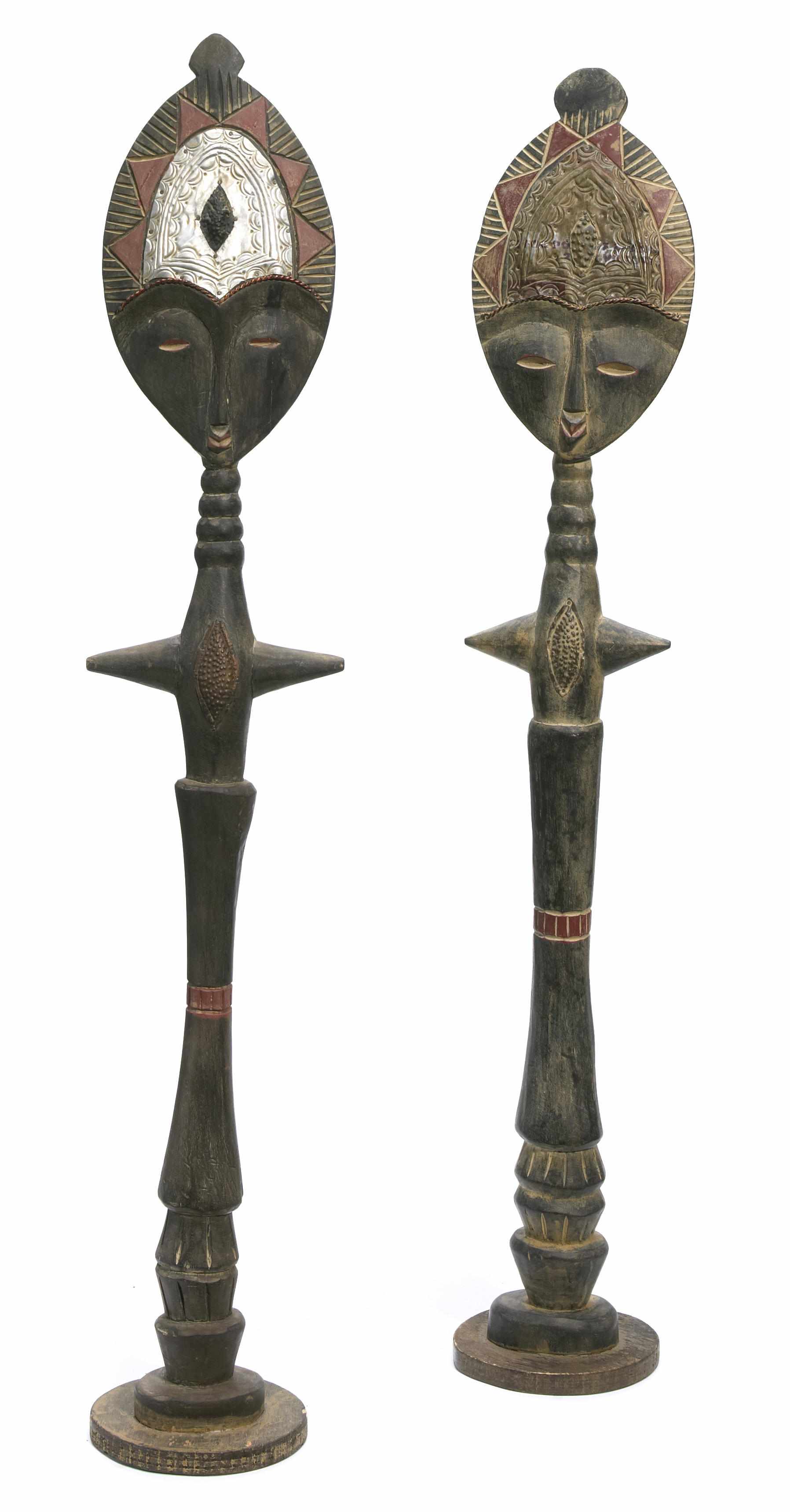 Appraisal: A pair of West African polychromed wood tribal figures th