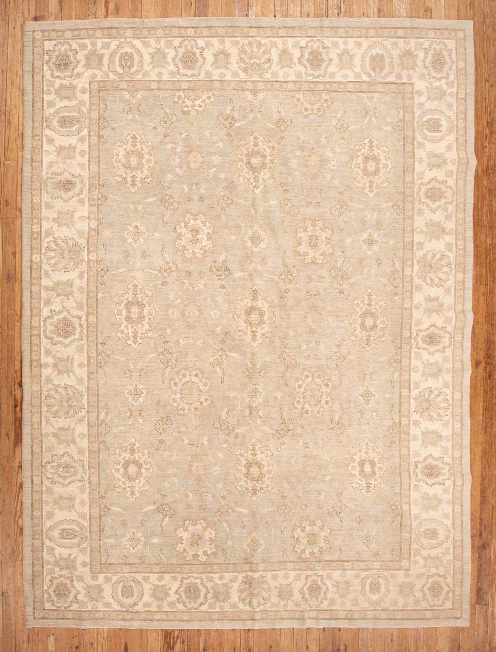 Appraisal: Oushak Carpet ivory and blue-gray ground stylized floral design ft