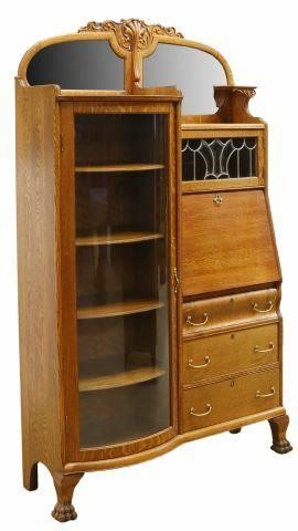 Appraisal: American oak side-by-side secretary bookcase c having a foliate carved