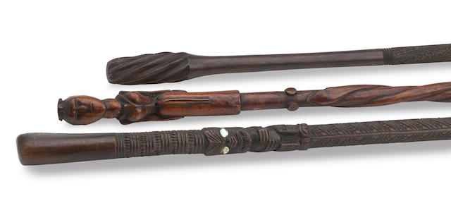 Appraisal: a Maori walking cane Carved throughout with three standing Maori